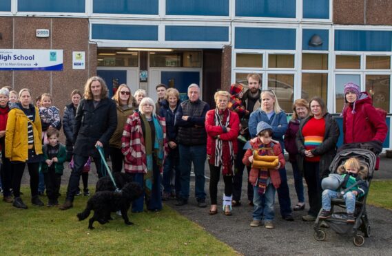 Group of parents standing outside Pitlochry High School.