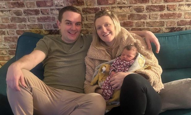 Louise Lyon, right, with baby Olivia and partner Steven Nicol.