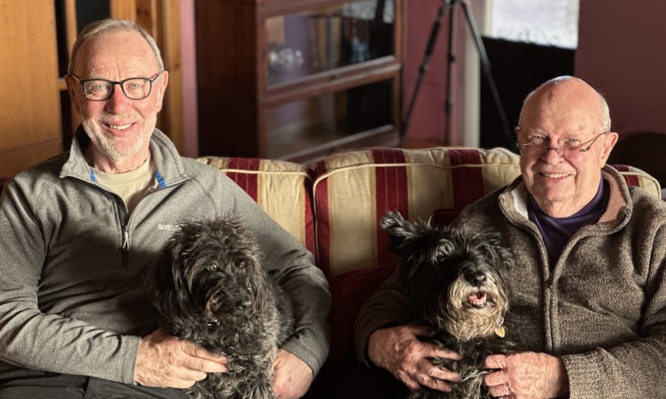 Robert Peat and Robert Hill with their dogs Landa and Ferguson.