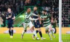 Celtic ran riot against Dundee at Parkhead - Greg Taylor celebrates making it 5-0. Image: PA