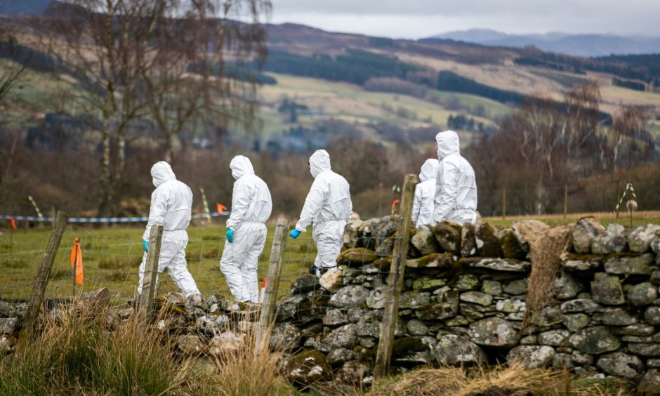 Forensics officers at the scene of Brian Low's murder near Aberfeldy.