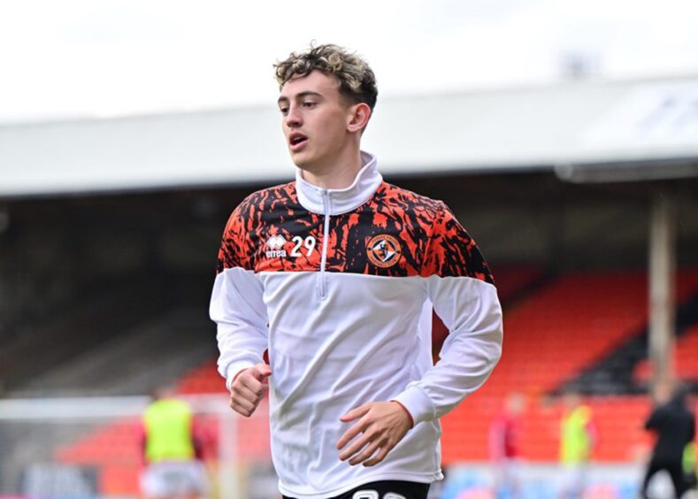 Miller Thomson warms up ahead of his first Dundee United home start