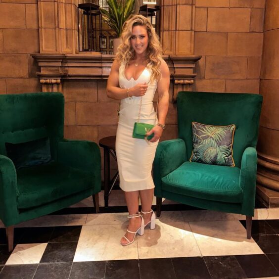 Sheli McCoy aka Sabre was in a white dress with green bag during Manchester night out with Gladiators cast.