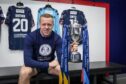 Raith Rovers captain Scott Brown sits in the Stark's Park dressing room with the SPFL Trust Trophy silverware.