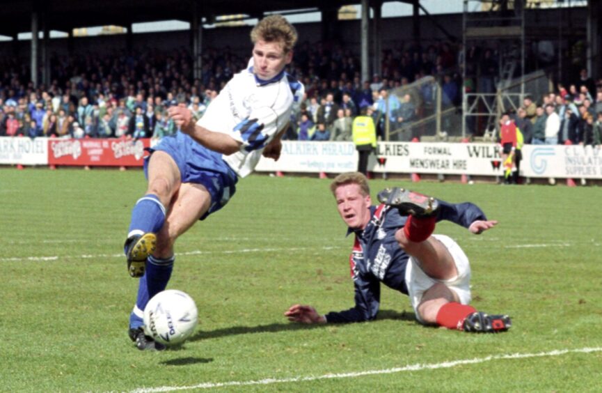 Mark Buglione evades a challenge from ex-Saint. Mark Treanor when St Johnstone faced Falkirk in 1993.