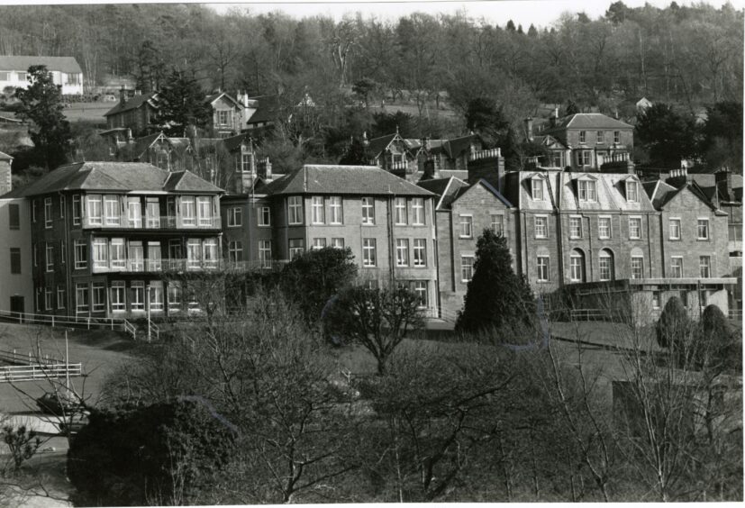 Black and white photo of old hillside hospital