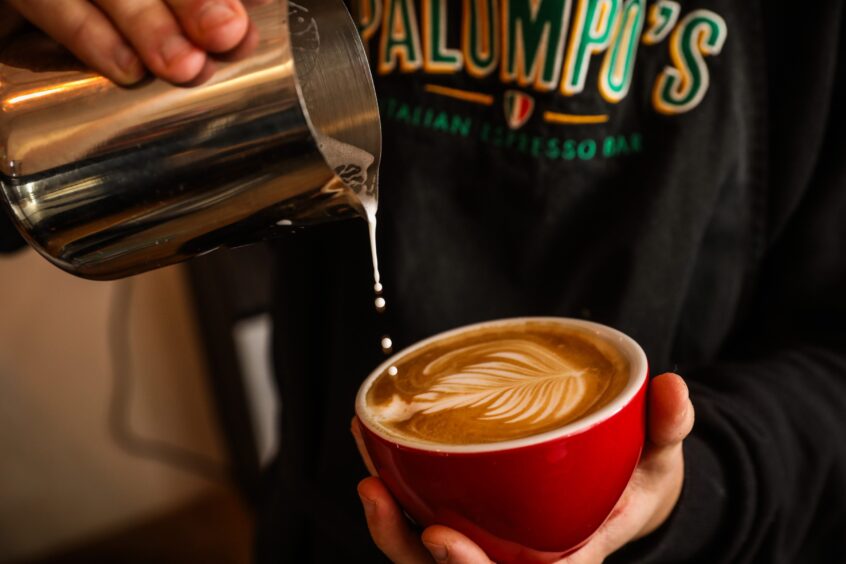 Archie creates latte art at Palompo's espresso bar St Andrews.