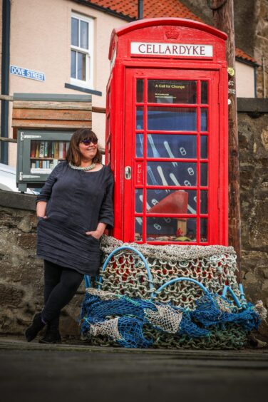 Image shows artist Cat Coulter with her installation A Call for Change at Gallery 495 in Cellardyke, Fife.