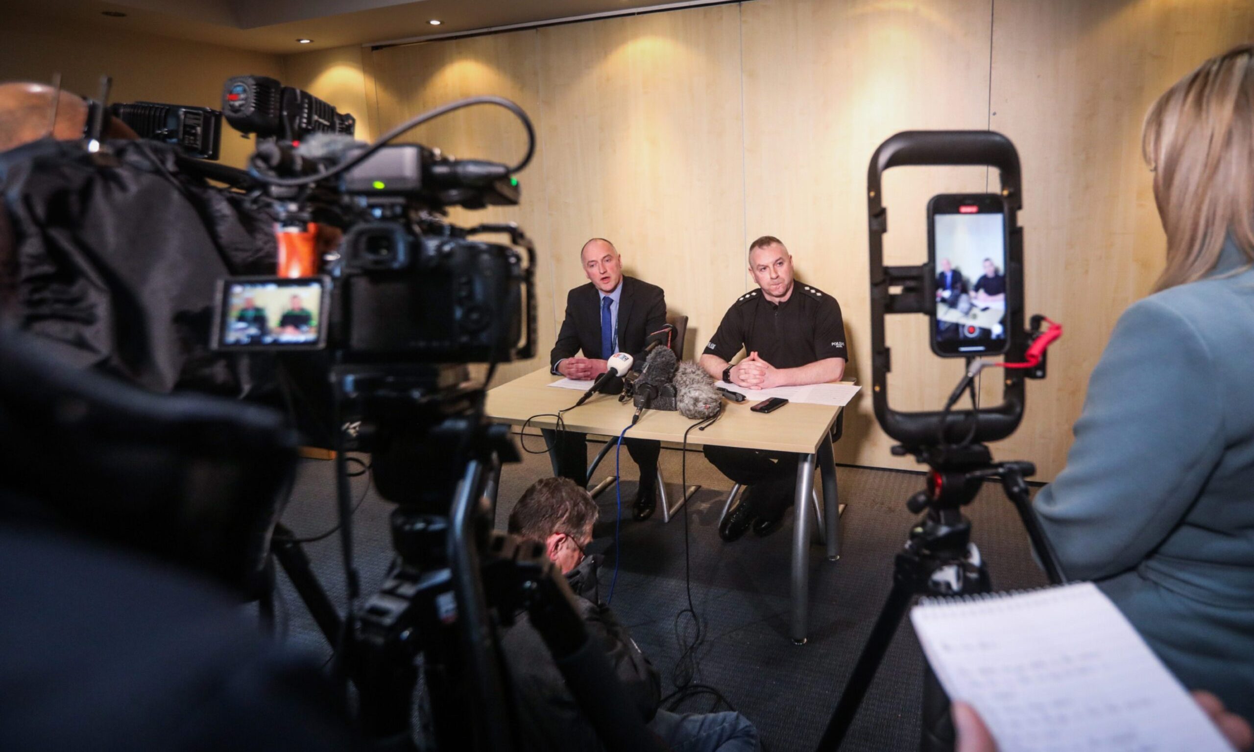 DCI Martin Macdougall and CI Greg Burns at a police press conference for the Aberfeldy murder of Brian Low, and a forensics officer at the scene. Image: Mhairi Edwards