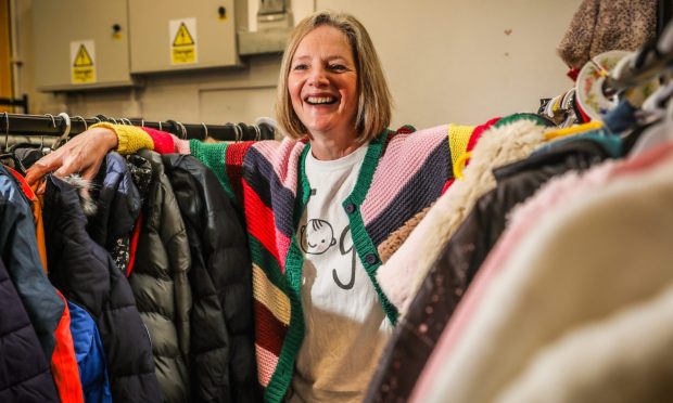 CR0046818, Cheryl Peebles, Dundee, Feature about Togs the clothing charity and the work they do to help clothe kids in need. Picture shows; Volunteer and Chair of Trustees Pauline MacDougall with some of the stock. Wednesday 7th February, 2024. Image: Mhairi Edwards/DC Thomson