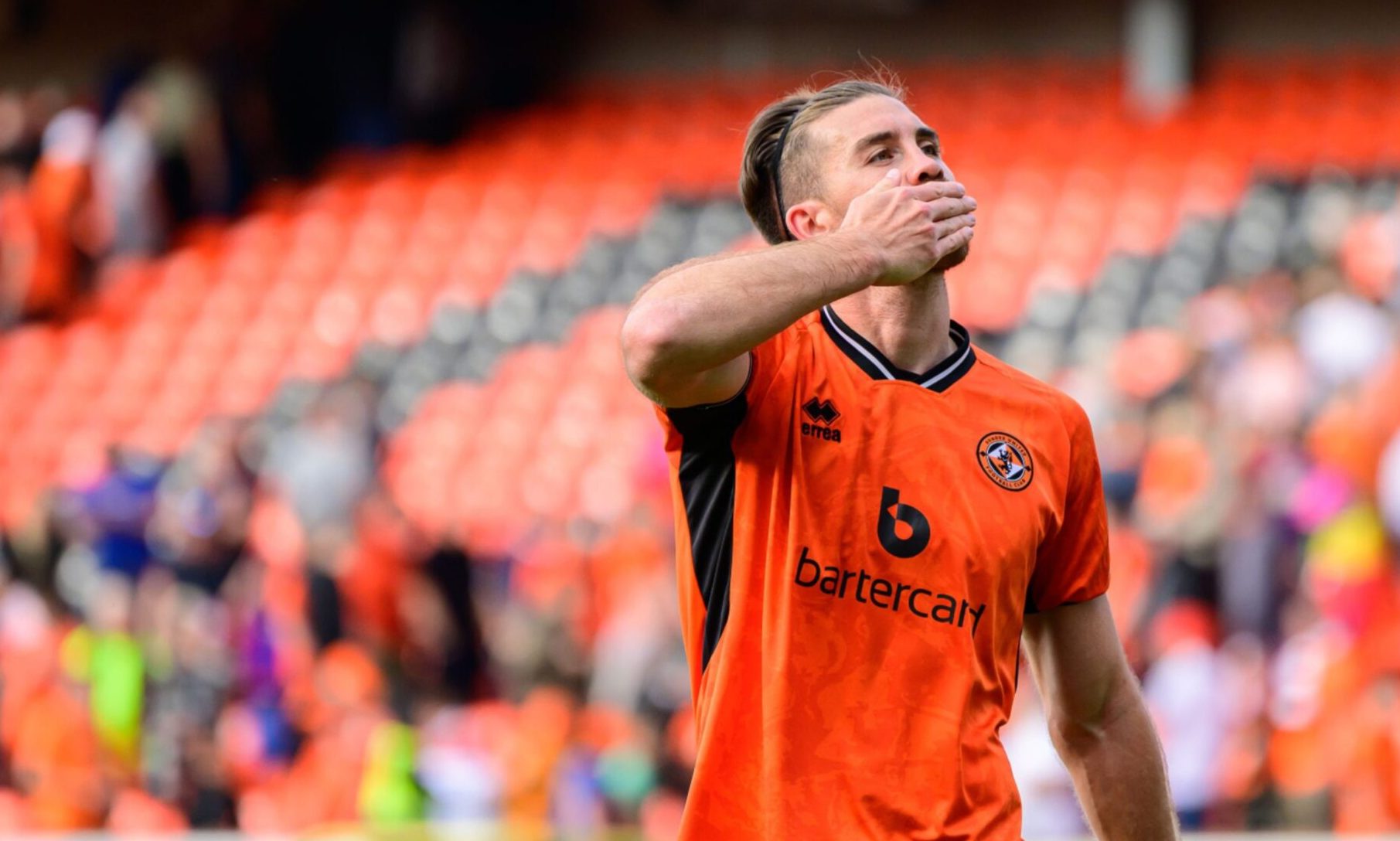Dundee United's Declan Gallagher salutes his family in the stands during a fixture at Tannadice earlier this season.