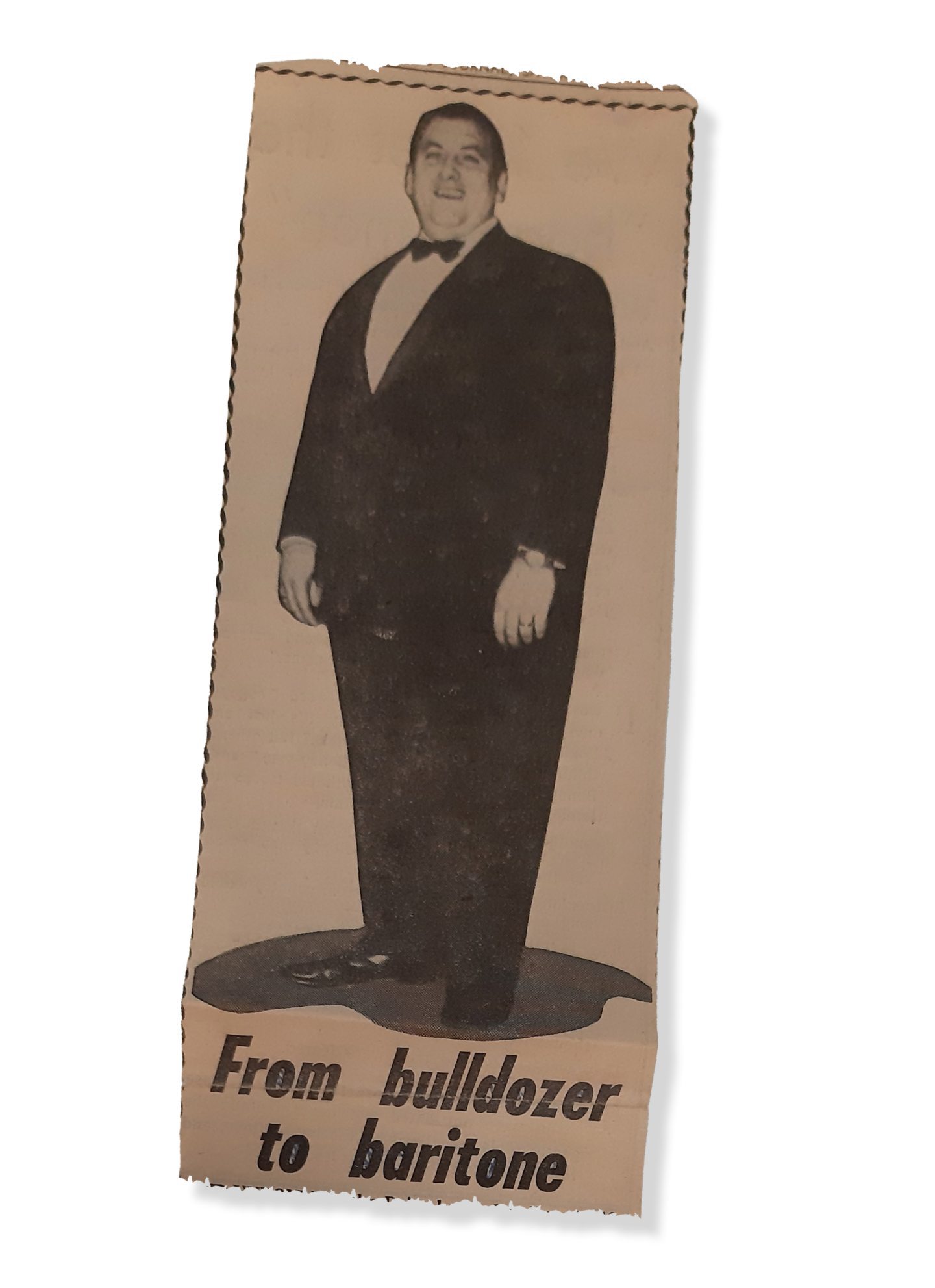 Dair, pictured in a newspaper clipping, made headlines in 1971. He is pictured in a suit with the caption reading: from bulldozer to baritone
