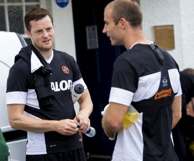 With former Dundee United teammate Jon Daly (left).