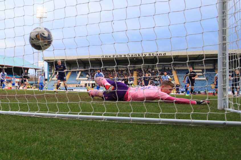 Killie keeper Will Dennis got a hand to McCowan's penalty but couldn't keep it out. Image: Shutterstock/David Young