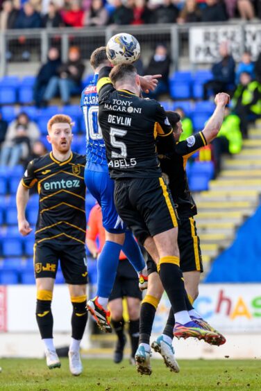 Livingston defender Michael Devlin wasn't penalised for this incident.