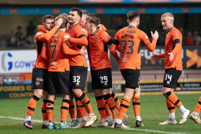Dundee United players celebrate a goal at Tannadice 