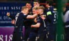 Dundee celebrate as they see off Aberdeen. Image: Shutterstock/David Young