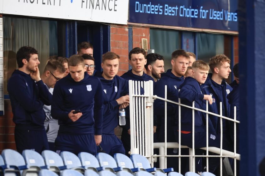 Dundee players wait to see if the Rangers game will go ahead. Image: Shutterstock/David Young