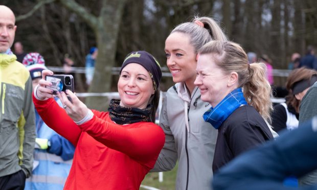 Eilish McColgan posing for a picture with fellow runners at the Camperdown parkrun. Image: Paul Reid.