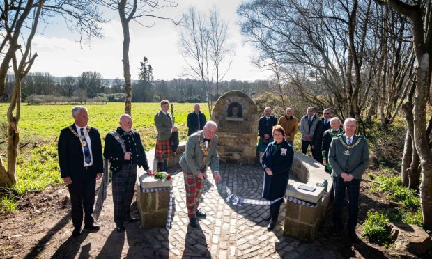 The ribbon is cut on the new cairn at Hillside. Image: Paul Reid