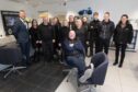 Park's Motor Group colleagues surround Frank as he is finally able to put his feet up. Image: Paul Reid