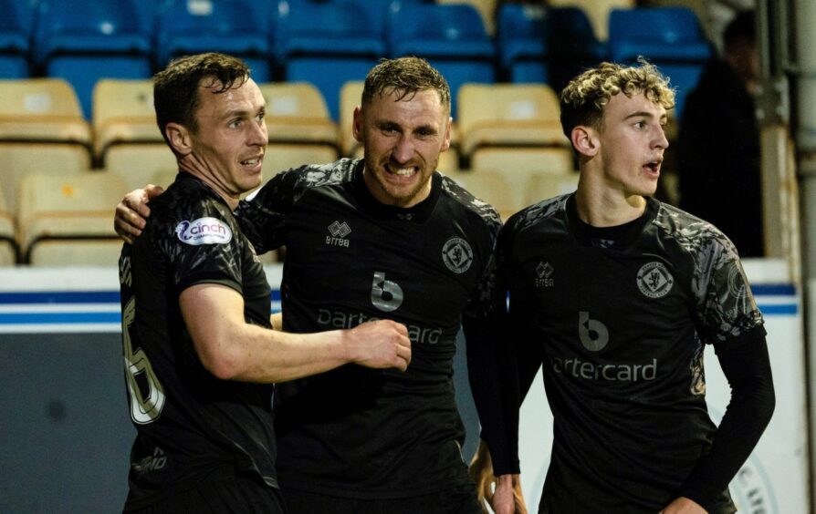 Dundee United's players celebrate Louis Moult's goal