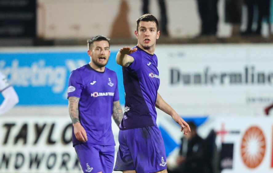 Nikolay Todorov gestures as he stands in front of Airdrie player-manager Rhys McCabe.