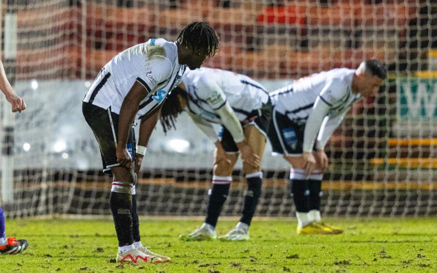 Dunfermline players Ewan Otoo, Miles Welch-Hayes and Michael O'Halloran all bend over with their hands on their knees.