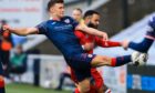 Raith Rovers midfielder Ross Matthews stretched out his right boot to connect with the ball in front of Dunfermline striker Alex Jakubiak.