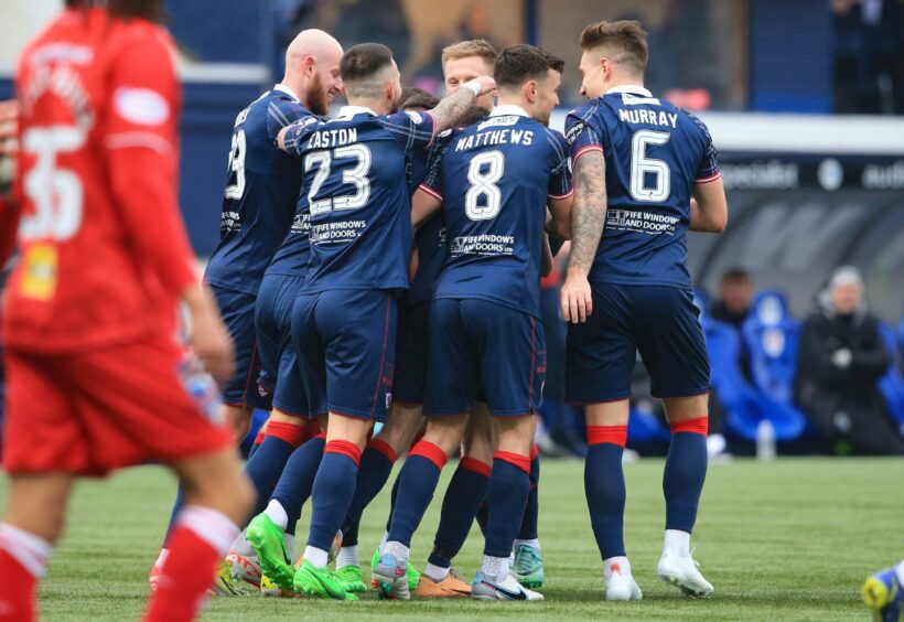 Raith Rovers players huddle together as they celebrate Sam Stanton's opener in their win against Dunfermline.