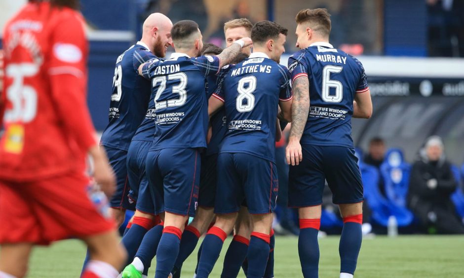 Raith Rovers players huddle together as they celebrate Sam Stanton's opener in their win against Dunfermline.