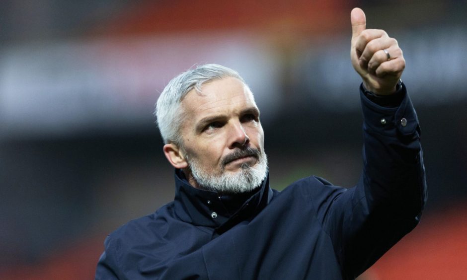 Dundee United manager Jim Goodwin gives a thumbs up to the crowd