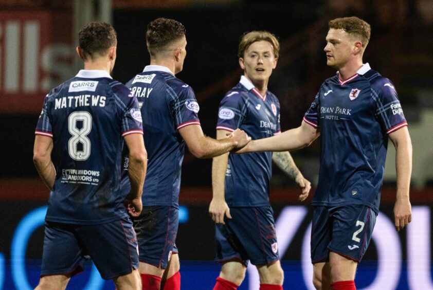 Ross Matthews, Euan Murray, Kyle Turner and James Brown celebrate Raith Rovers' winning goal against Partick Thistle.