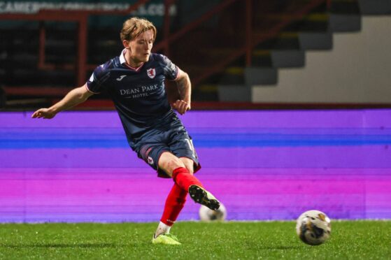 Kyle Turner plays a low pass with his instep during Raith Rovers' win against Partick Thistle.