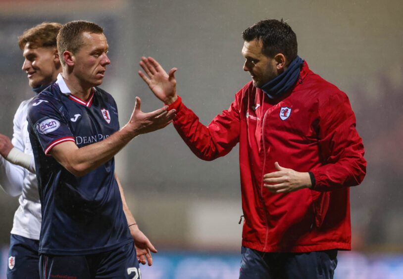 Raith Rovers manager Ian Murray and skipper Scott Brown shake hands at full-time.