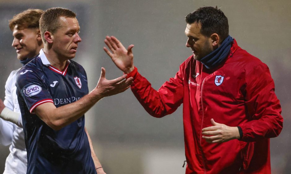 Raith Rovers captain Scott Brown and former manager Ian Murray shake hands.