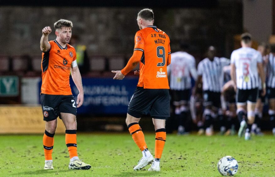 Ross Docherty, left, and Louis Moult exchange words as Dundee United crash