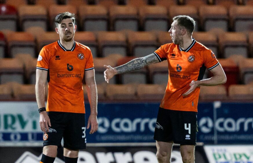 Kevin Holt, right, and Declan Gallagher exchange words after Dundee United concede