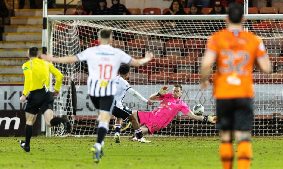 Kane Ritchie-Hosler shoots at goal to put Dunfermline three goals ahead against Dundee United.