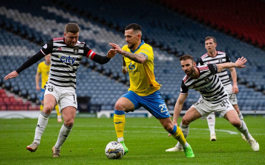 Raith Rovers attacker Dylan Easton takes on Queen's Park skipper Dom Thomas with the ball at his feet.
