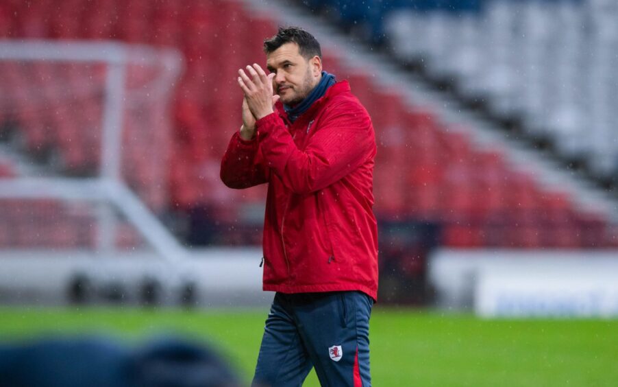 Raith Rovers manager Ian Murray claps the visiting supporters at full-time at Hampden.