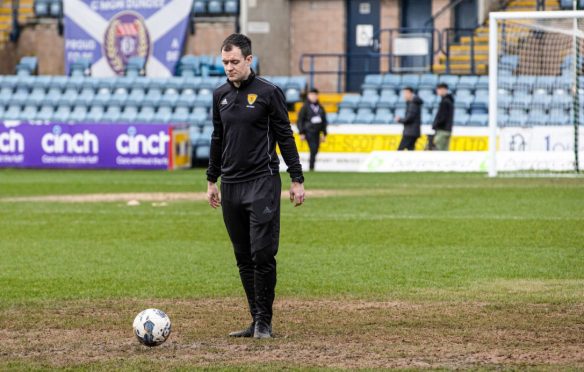 Don Robertson carries out pitch inspection at Dens Image: SNS.