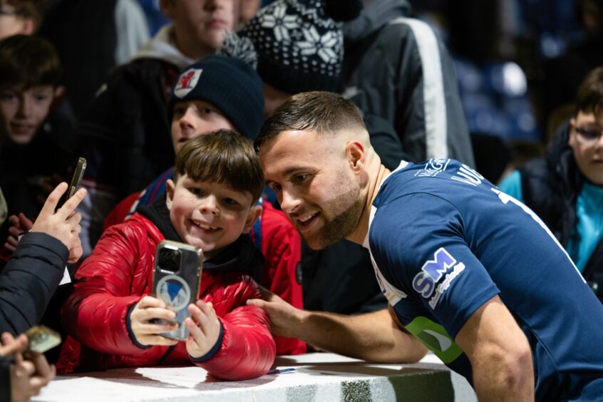 Vaughan meets young fans at the end of his testimonial match against Hibs. 