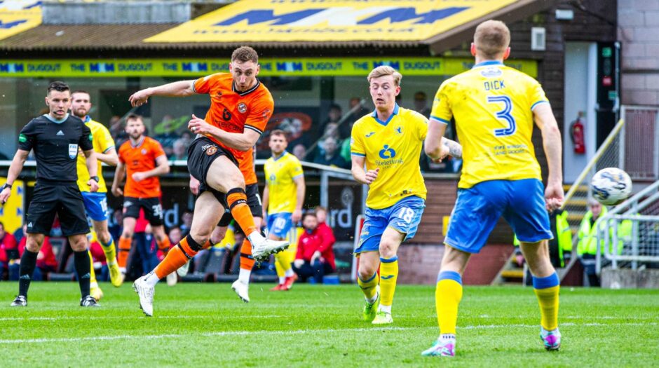 Dundee United striker Louis Moult blasts in a shot with Raith Rovers players Kyle Turner and Liam Dick looking on.