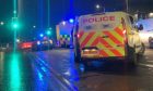 Police and ambulance at the scene in Dunfermline after a woman was hit by a car.