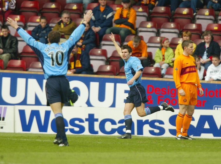 Mark Burchill celebrates one of three goals for Dundee