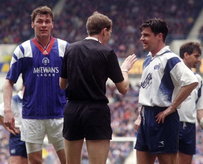 Kenny Clark speaks to Jock McStay and Duncan Ferguson following the incident.
