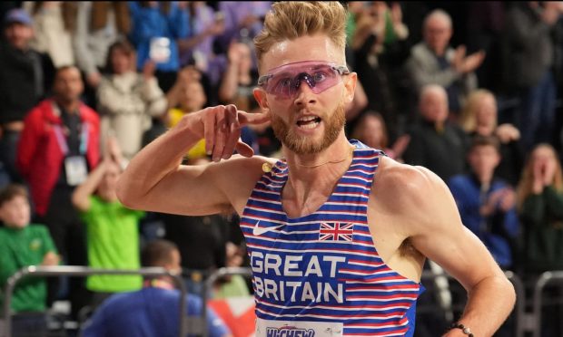 Josh Kerr celebrates winning the men's 3,000 metres at the World Indoor Athletics Championships in Glasgow.