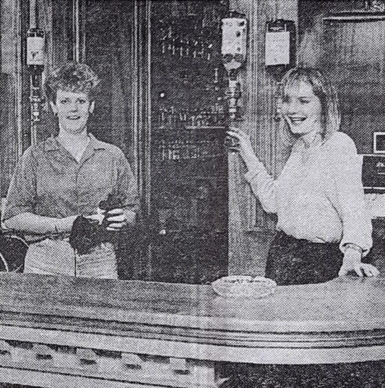 Globe Bar, Dundee, staff behind the bar in 1984.