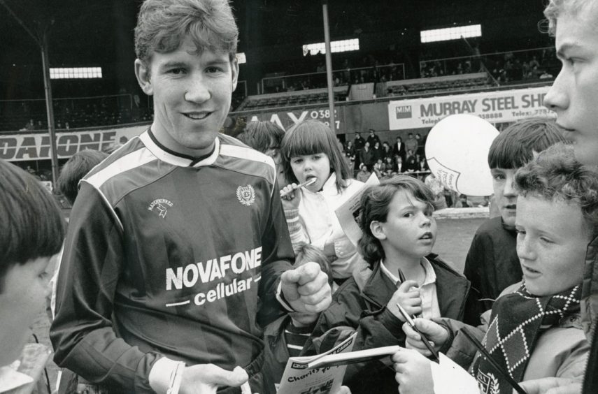 Keith Wright signs autographs at a Dundee FC open day in 1988. 